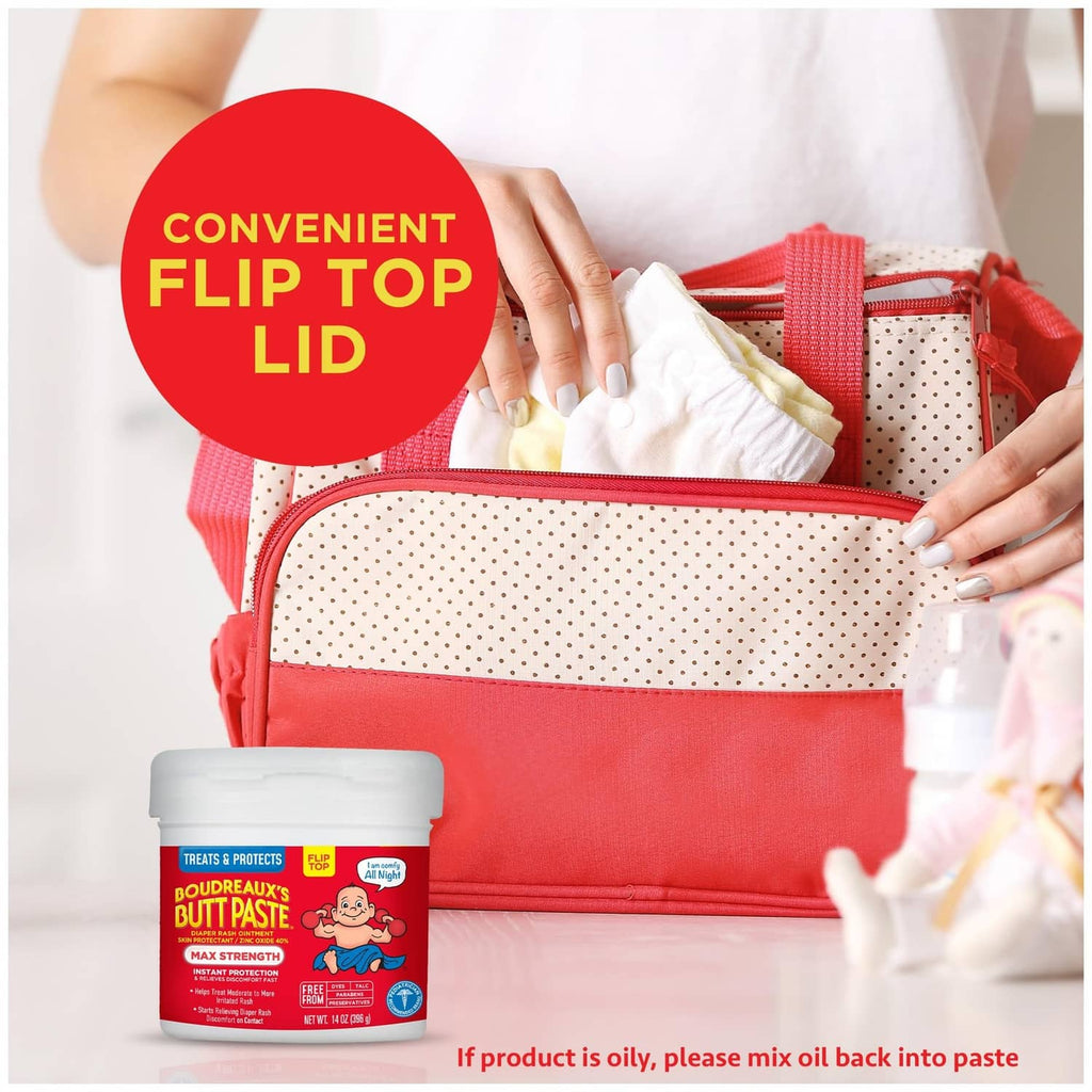 Diaper rash cream jar with flip-top lid, shown near a red toiletry pouch