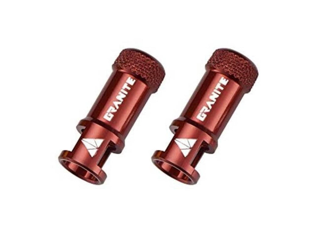 Pair of red Presta valve caps with textured tops and GRAVITE branding