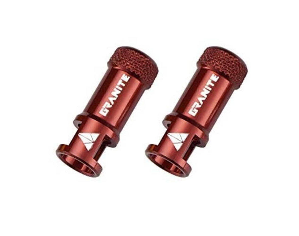 Pair of red Presta valve caps with textured tops and GRAVITE branding