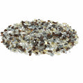 Mixed clear, copper, and gold glass fire pit rocks, scattered pile