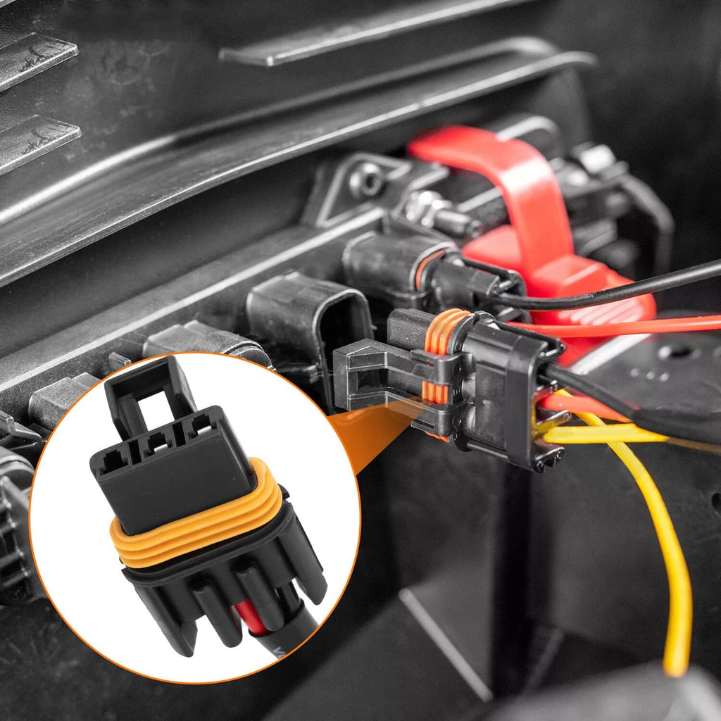 Close-up of black wiring connector plug with orange latch and colored wires