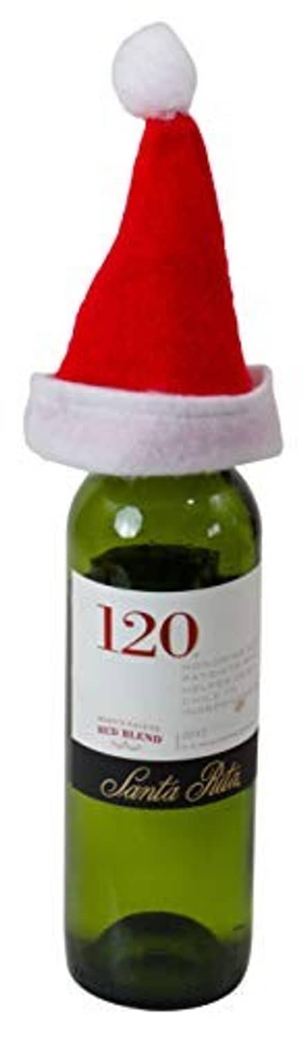 Red felt mini Santa hat with white cuff on a small green bottle