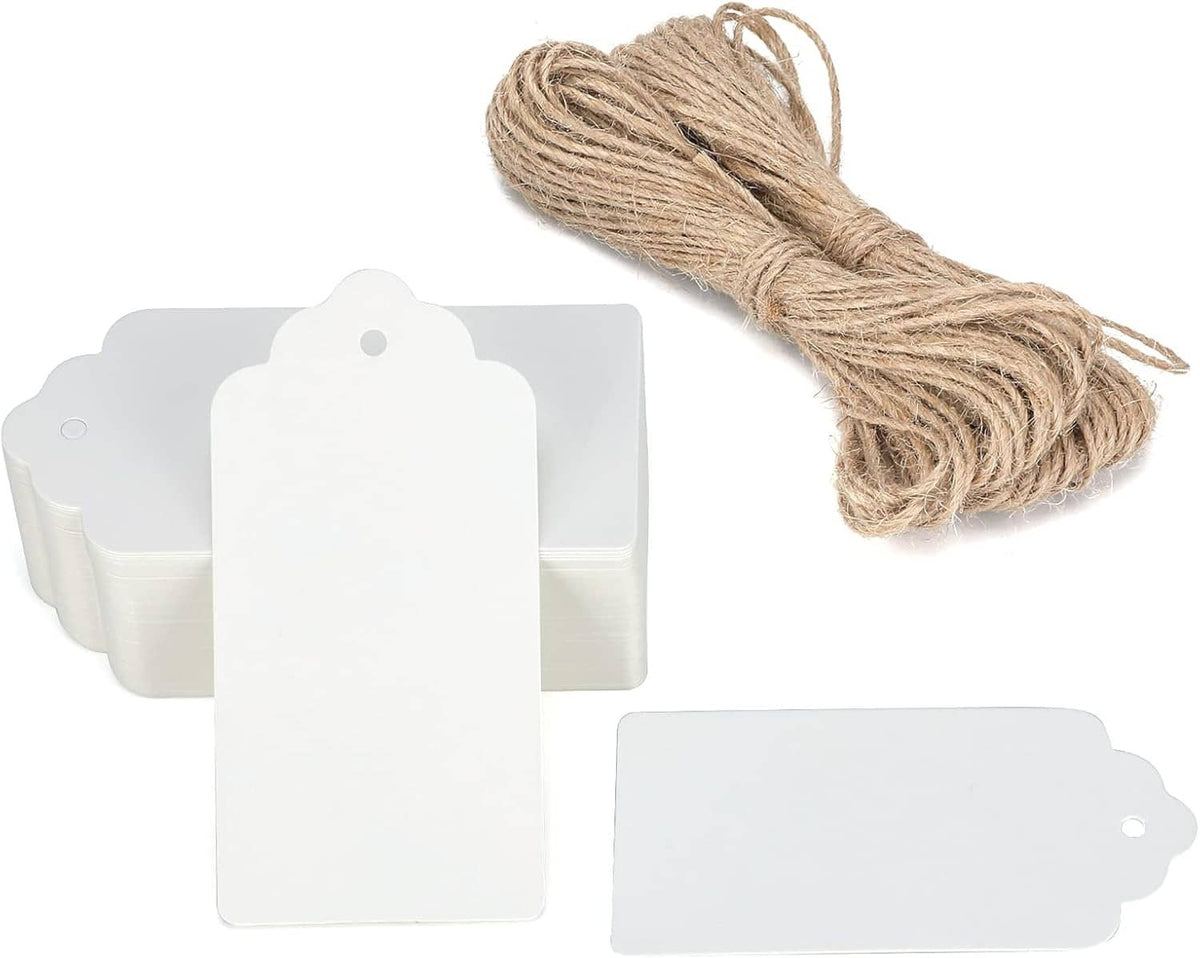 Set of white rectangular gift tags and bundled twine string, blank for writing