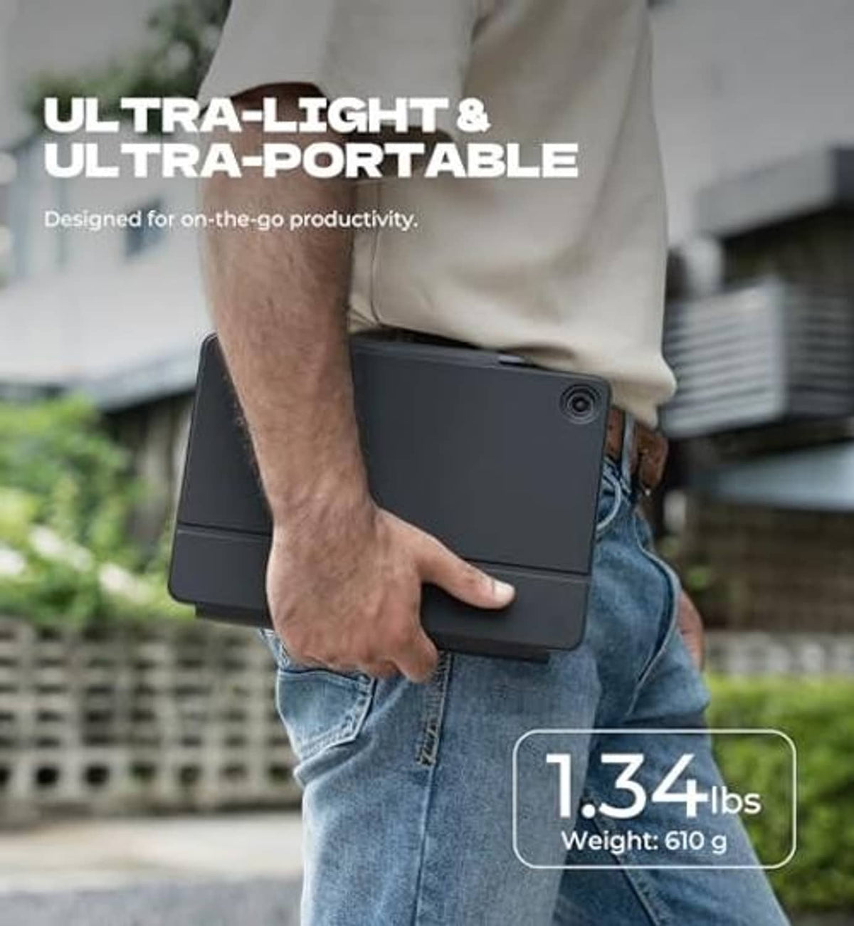Black tablet keyboard case held in hand, slim protective cover with stand