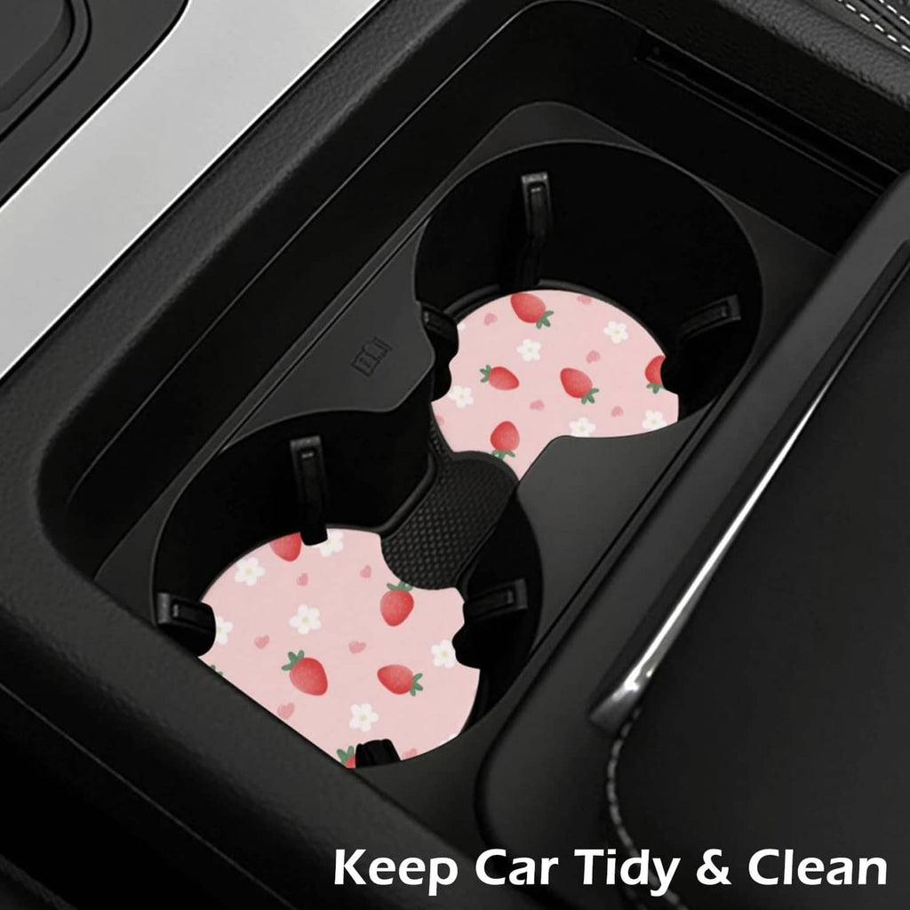 Two pink strawberry-pattern car cup coasters in cup holders with anti-slip base