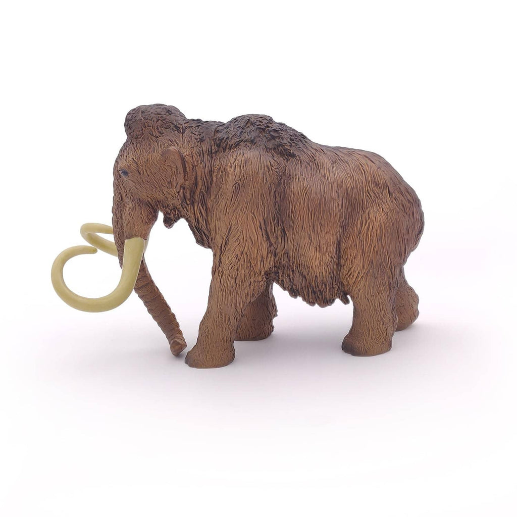 Woolly mammoth toy with ivory tusks, side view on plain background