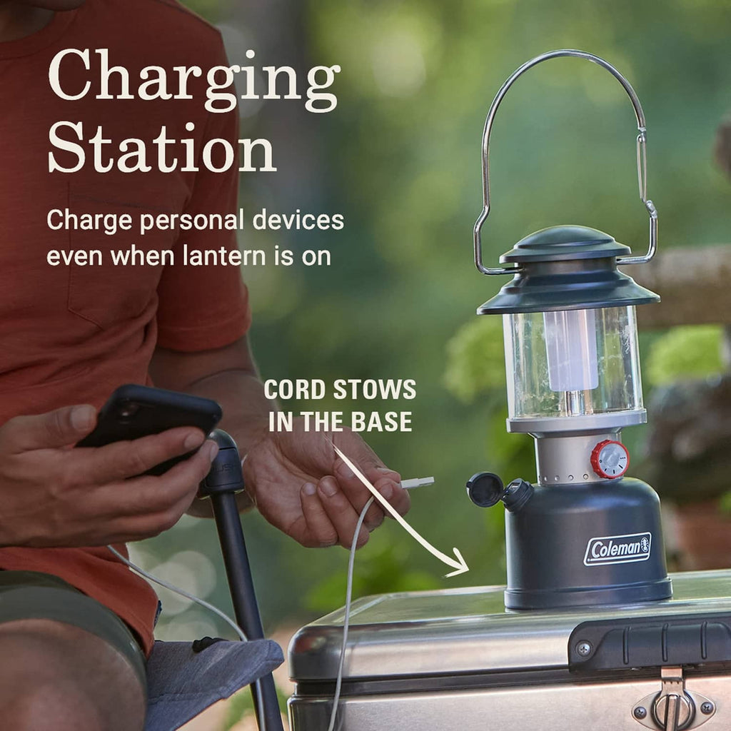 Black Coleman LED lantern on stand with base dial and stowed cord in housing.