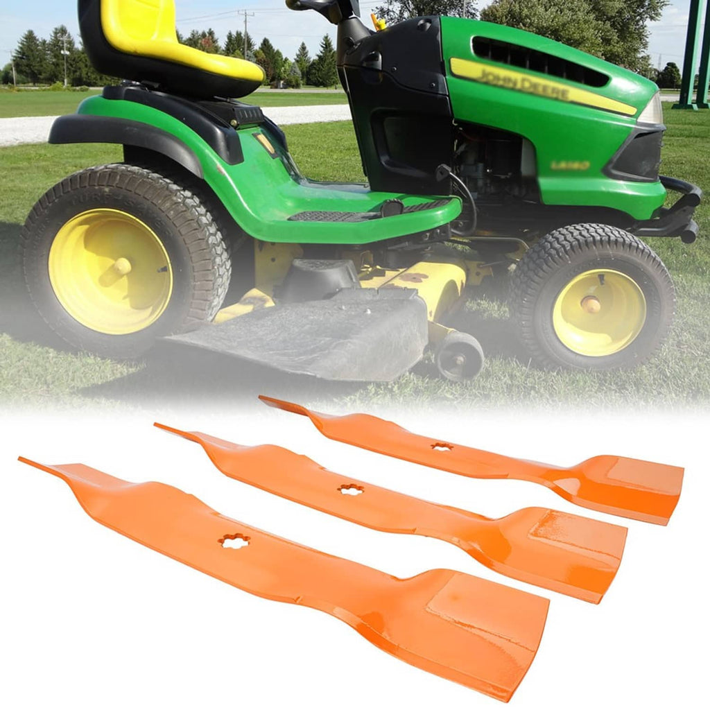 Orange mower deck blades laid out below a green lawn tractor mower deck