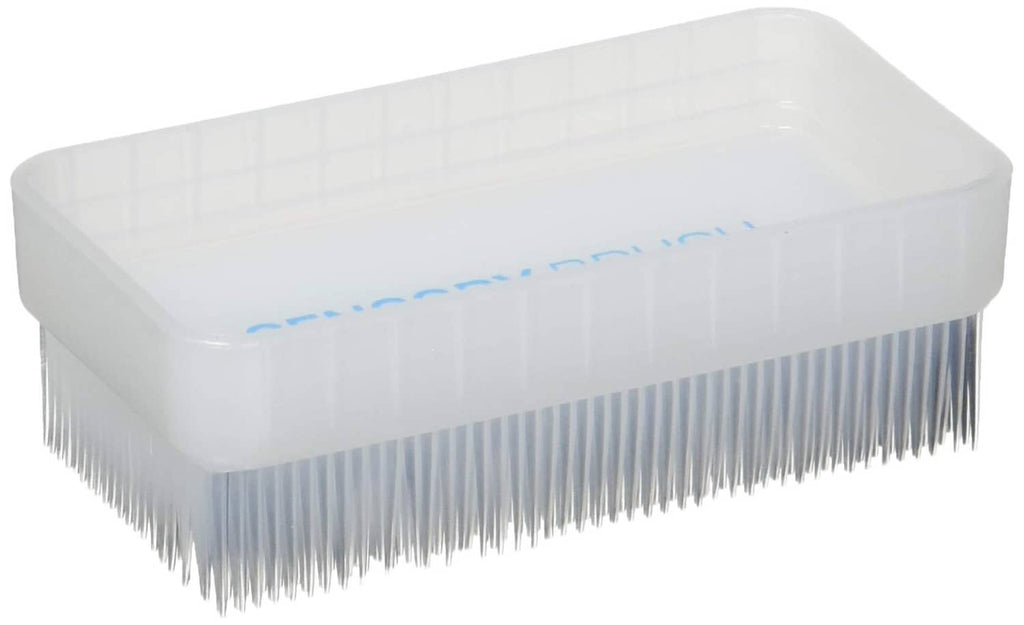 Therapy pressure brush with white foam pad and fine bristles on a clear base