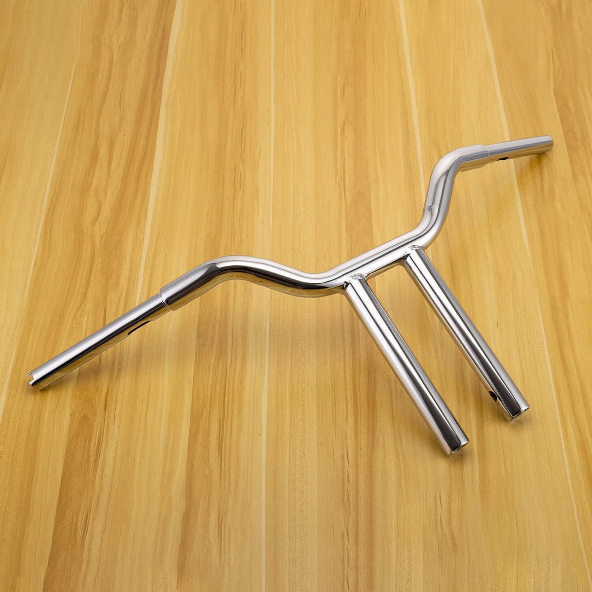 Chrome 14-inch T-bar handlebar shown from the side with curved arms