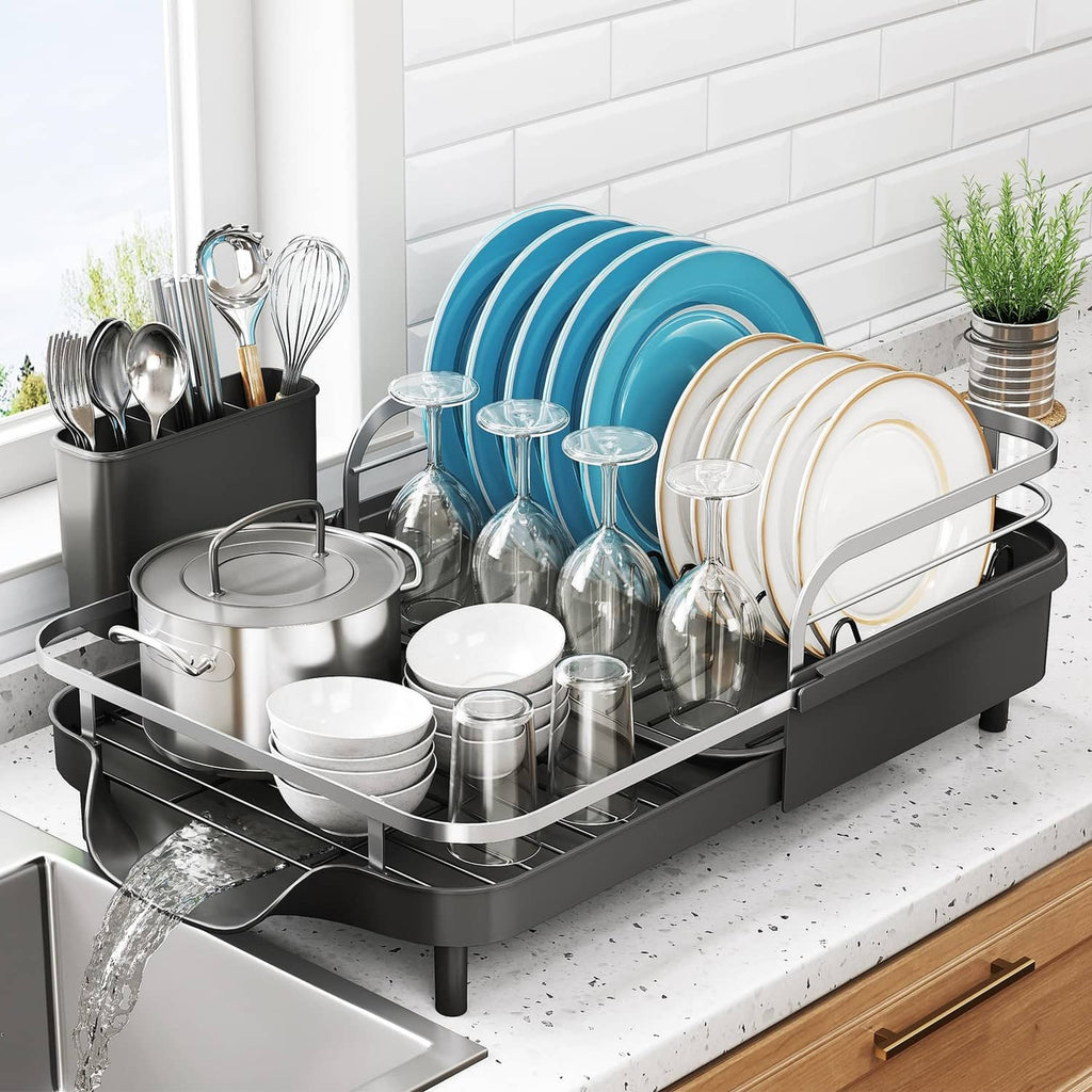 Expandable black dish drying rack with utensil holder and dish drain rails