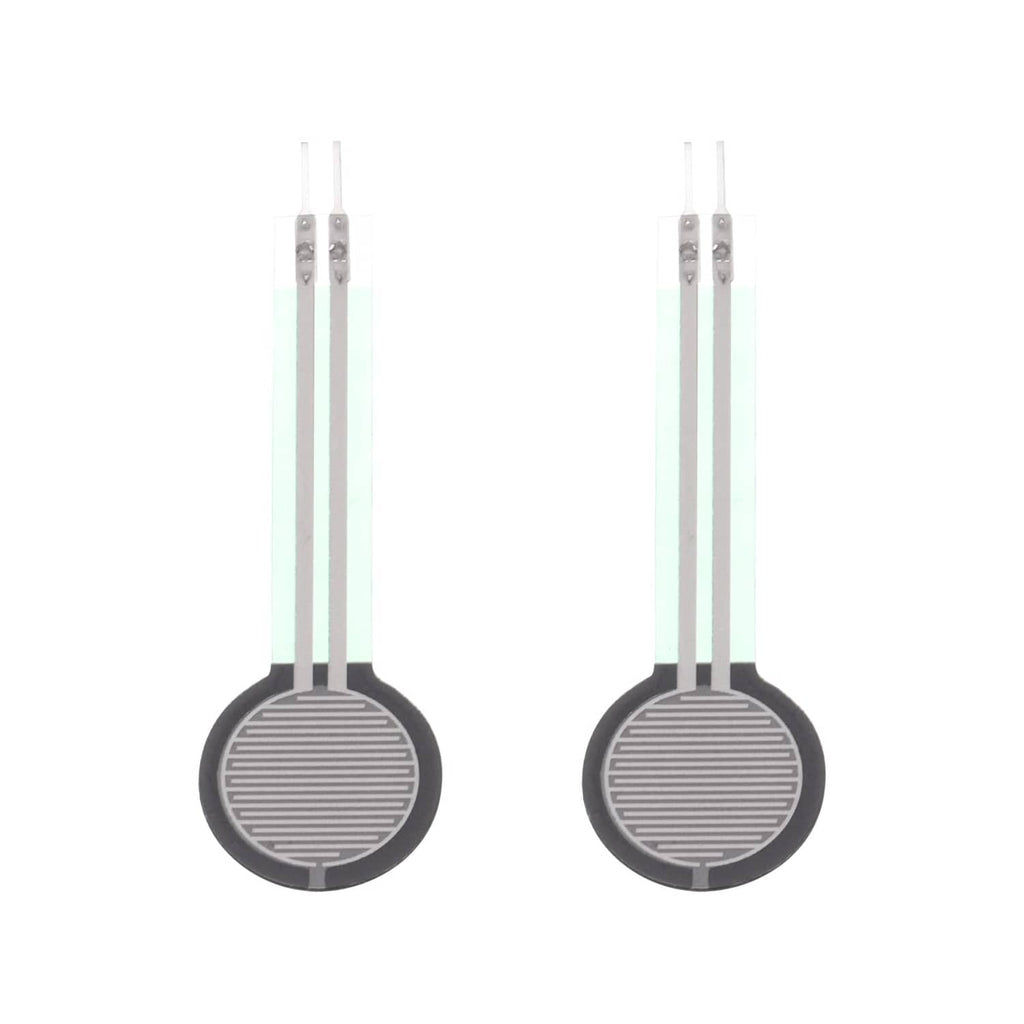 Thin film pressure sensor pair with two round black discs and two white lead wires