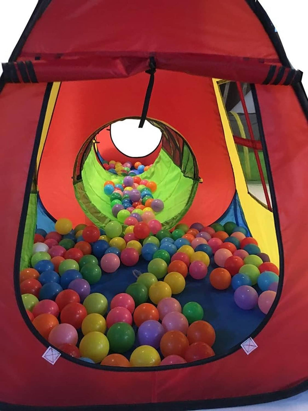 Kids ball pit play tent with red fabric and multicolor plastic balls inside