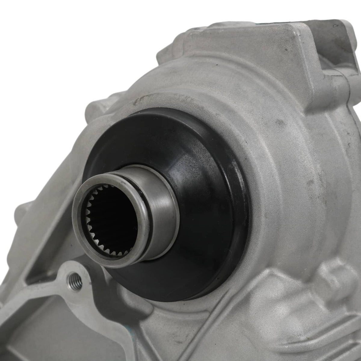Transfer case assembly close-up of black internal seal and toothed ring in gray housing