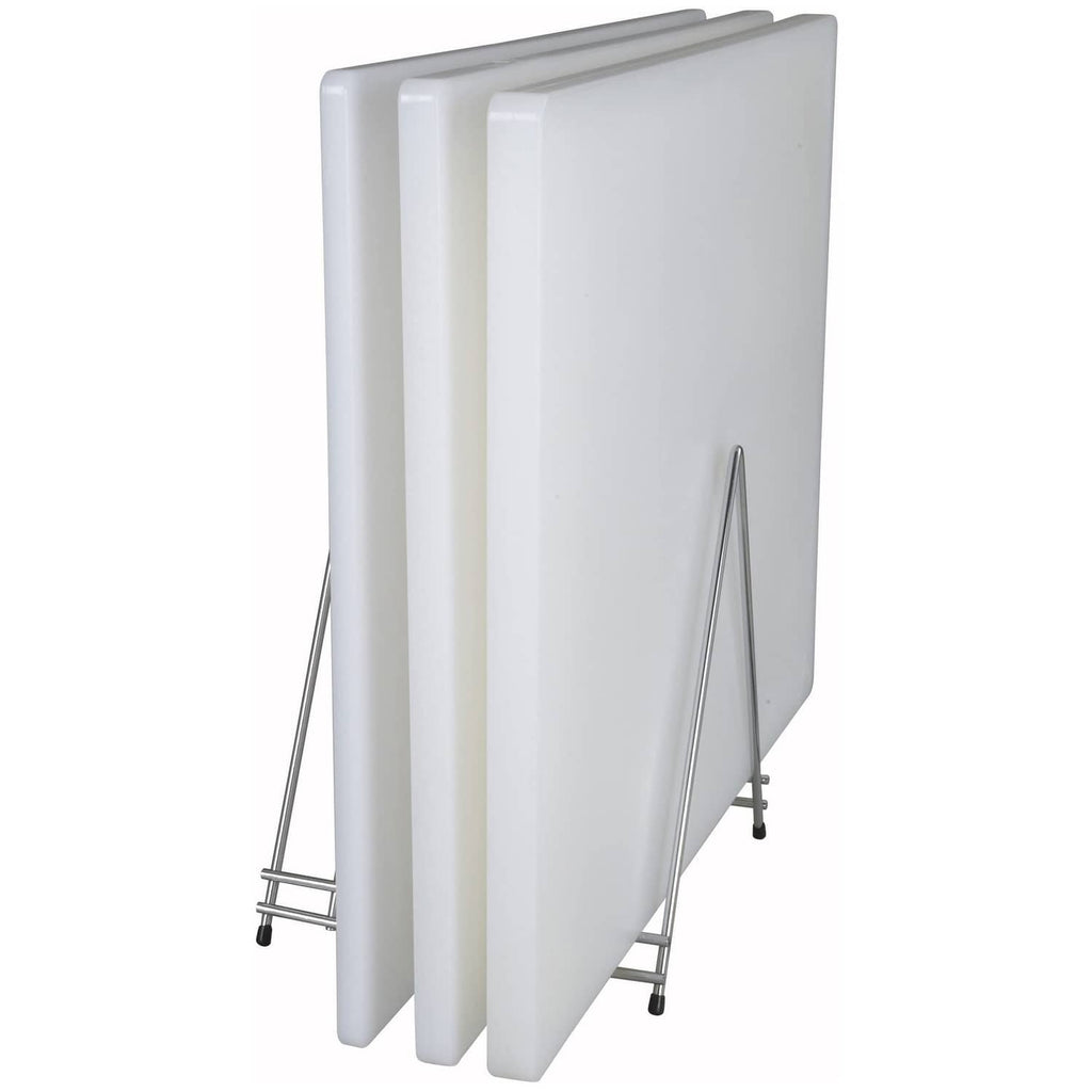 Stacked white plastic cutting boards on metal stand, side view