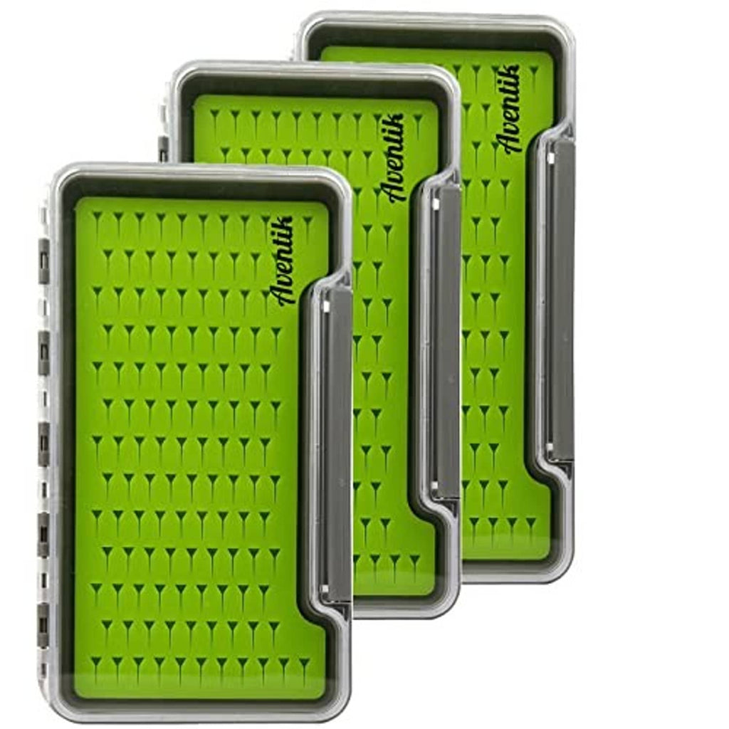 Three green silicone fly fishing trays with clear plastic lids in gray waterproof case