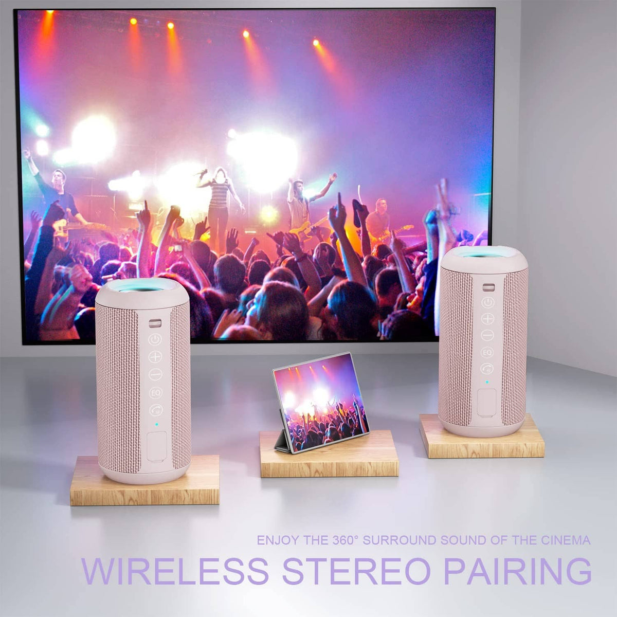 Two pink portable Bluetooth speakers with glowing LED light rings on wood stands