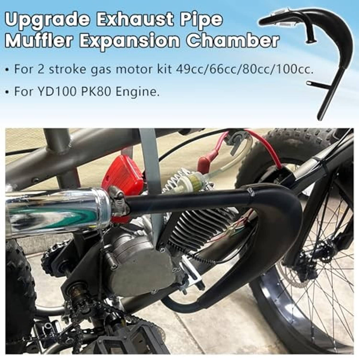 Black exhaust muffler expansion chamber pipe with hardware installed near the engine
