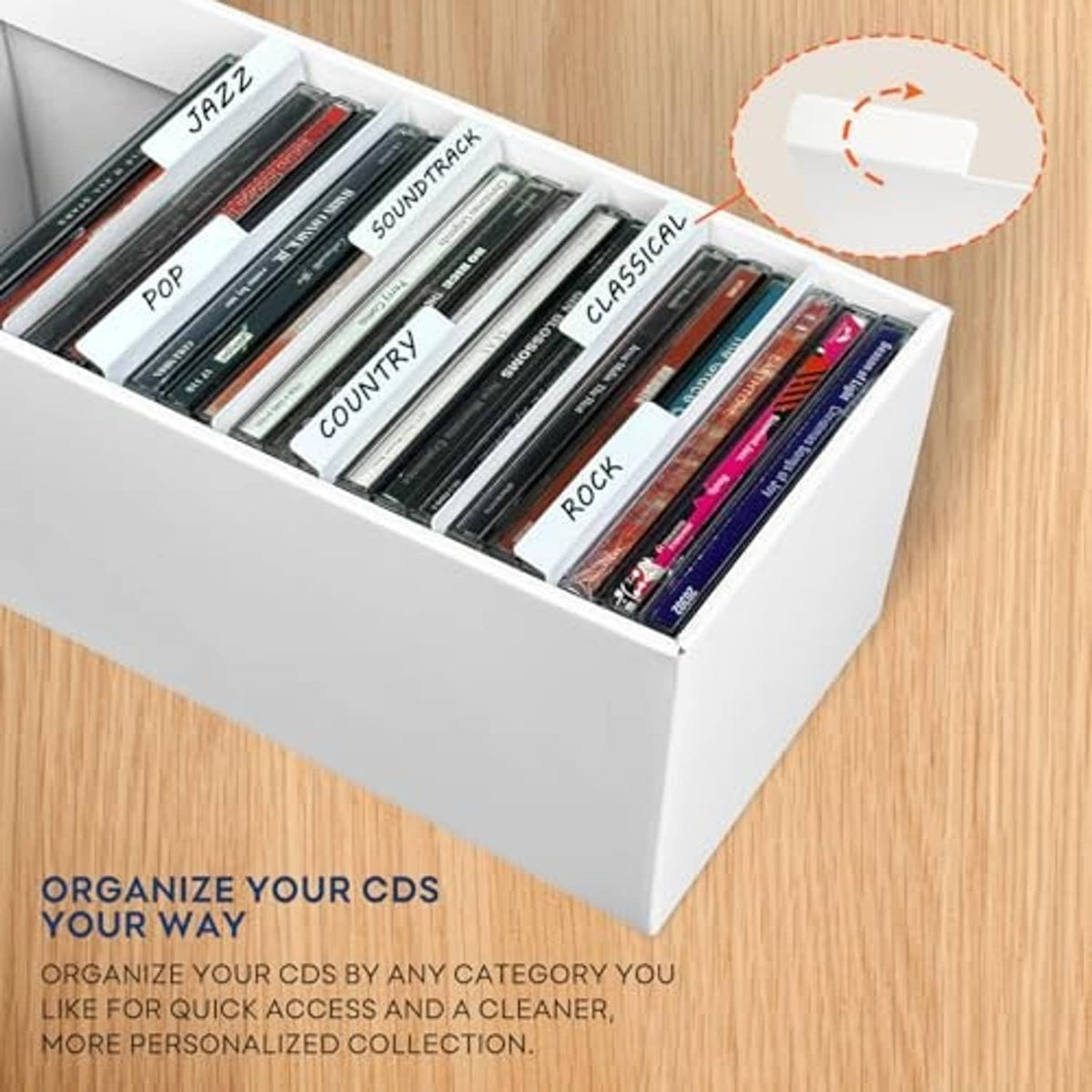 White cardboard CD storage box open on side, holding arranged CD cases