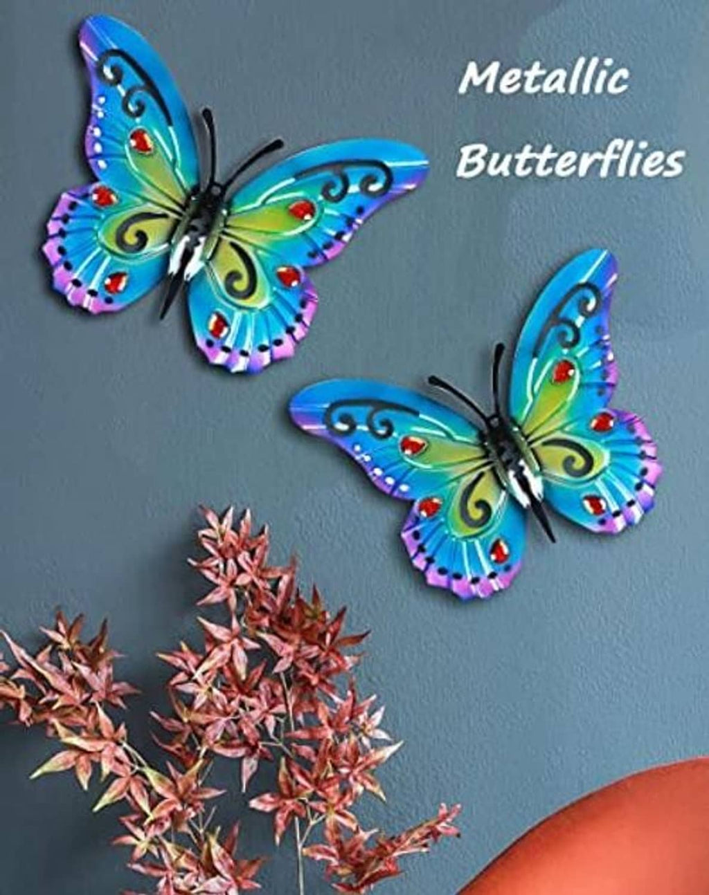 Metal butterfly wall decor set with blue-green wings, purple edges, and red centers