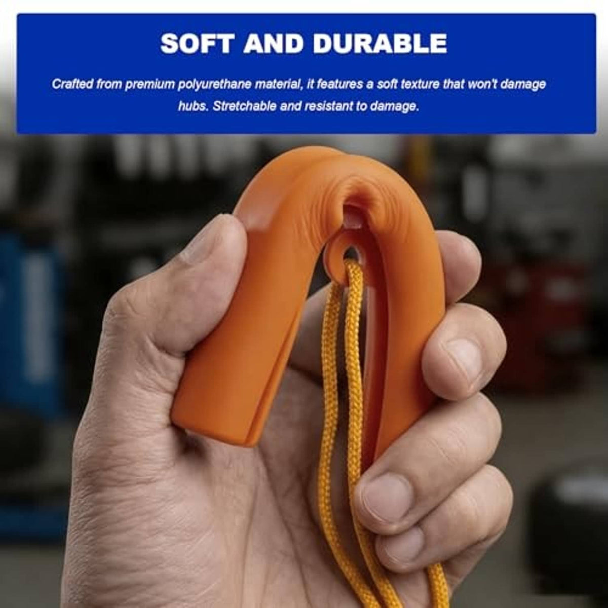 Orange wheel rim protector held in hands with yellow cord attached