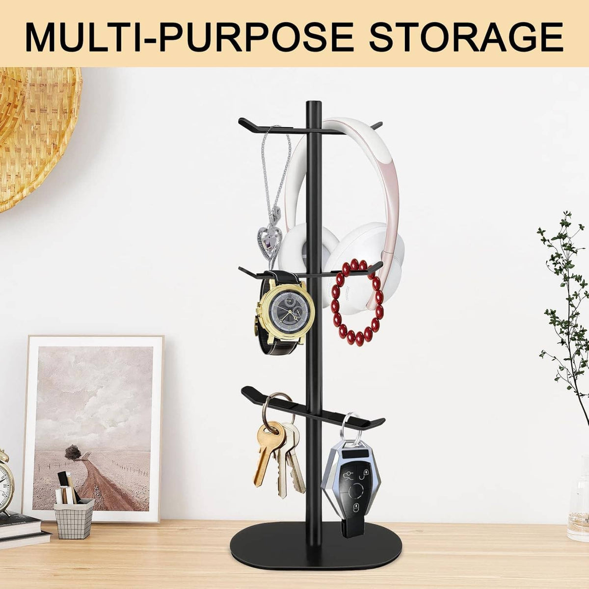 Black cup holder tree with six hooks, hanging keys and a watch on the pole