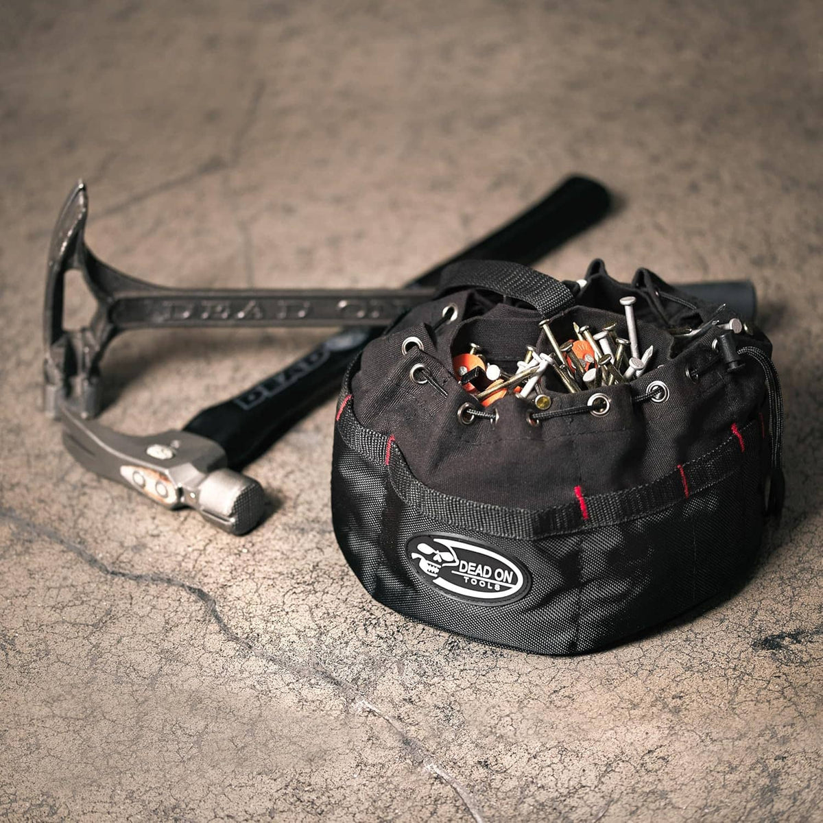 Black parachute bag with tools visible and DEAD ON TOOLS logo on front