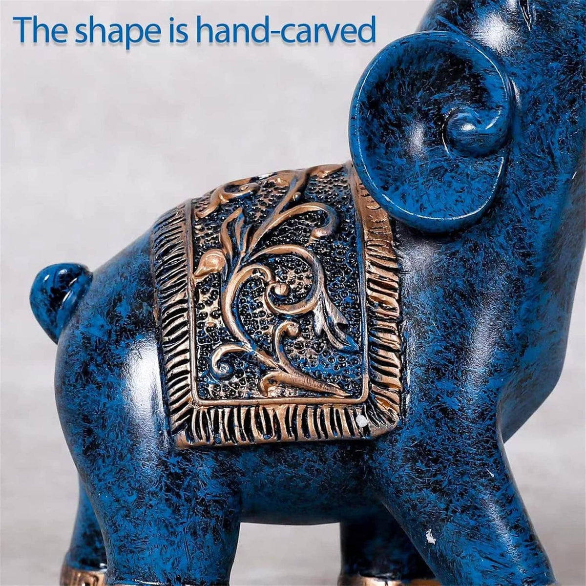 Blue elephant figurine with raised gold filigree panel and large round head