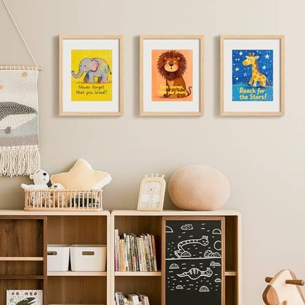 Set of 3 natural wood picture frames displayed on a wall above a shelf