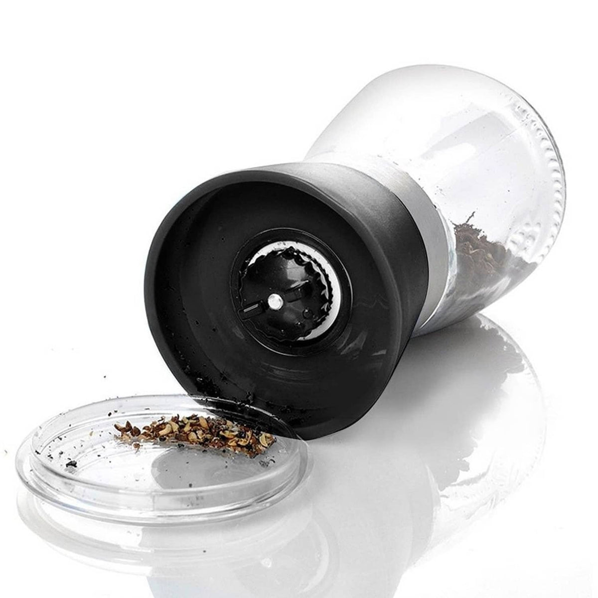 Manual salt and pepper grinder with cap removed, showing black grinding insert