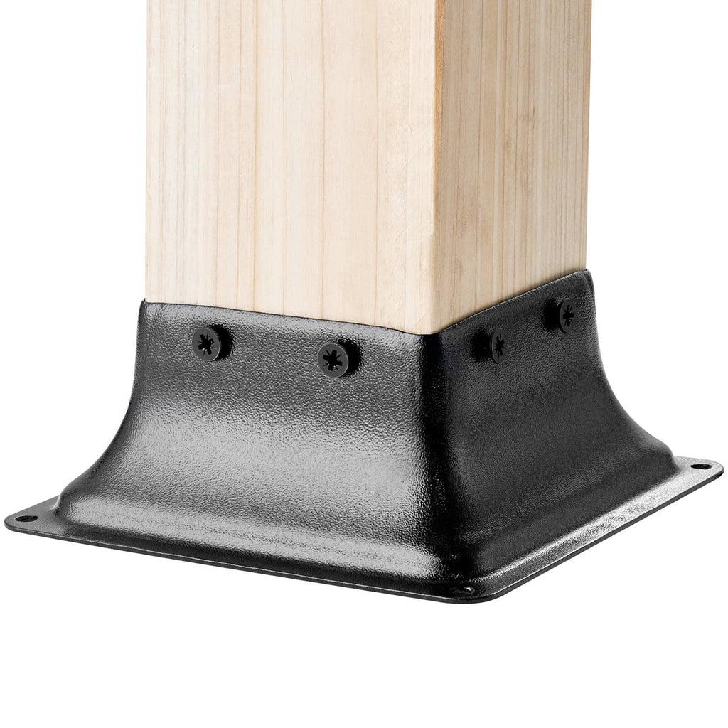 Steel post base bracket with screws, mounted on a 4x4 wood post corner