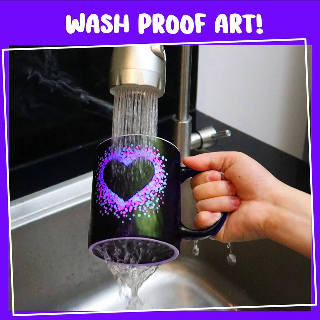 Decorated bottle with a heart design, showing water running over the painted area.