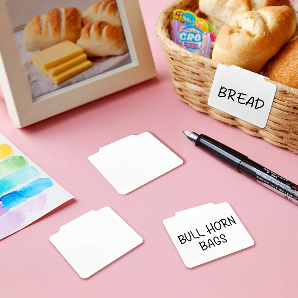 White removable label cards for organizing items like bread, with blank writing area