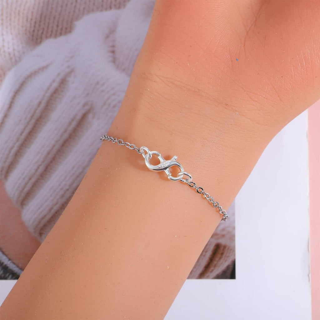 Sterling silver lobster claw clasp on necklace chain with oval links near wrist
