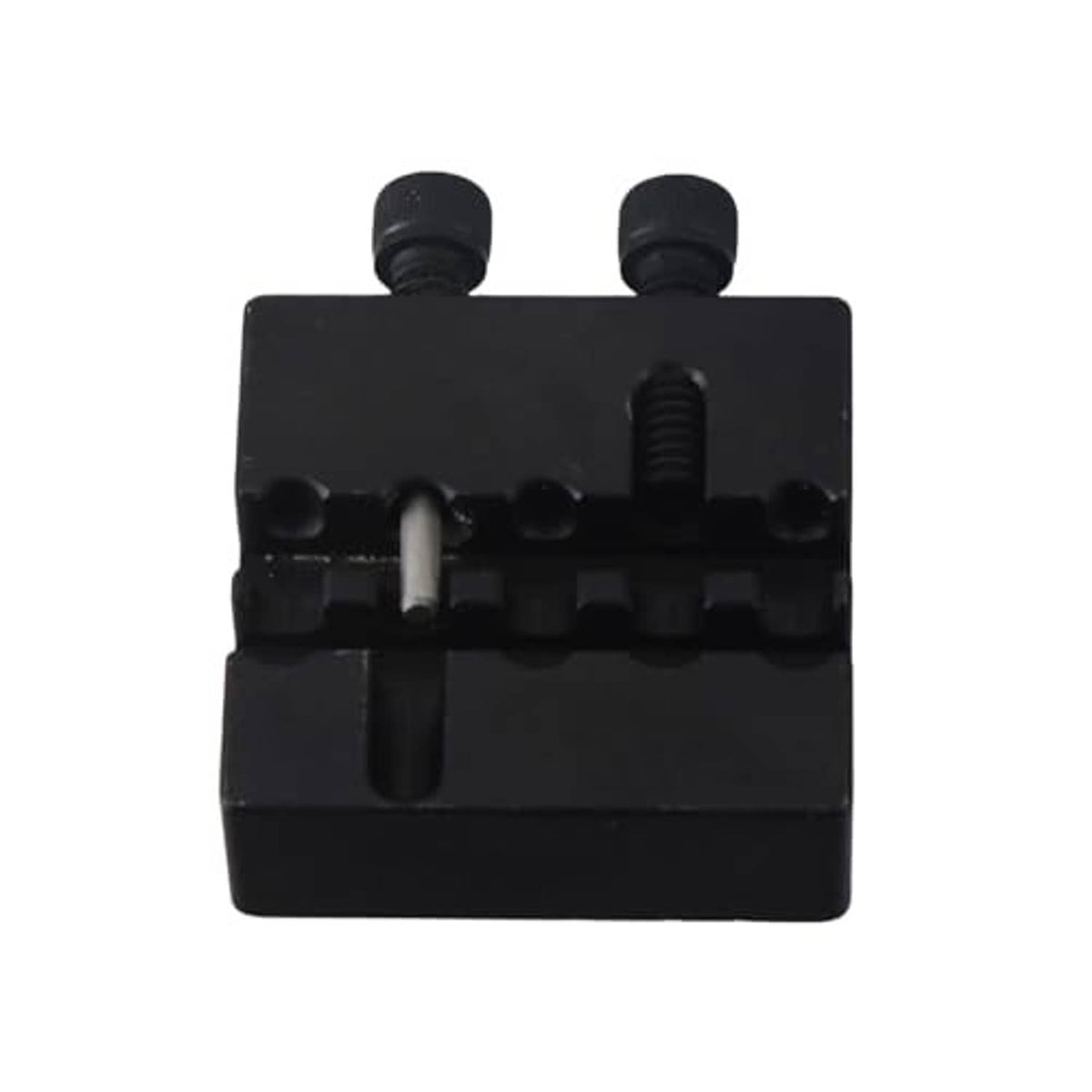 Black chain breaker tool underside with central punch and two screws