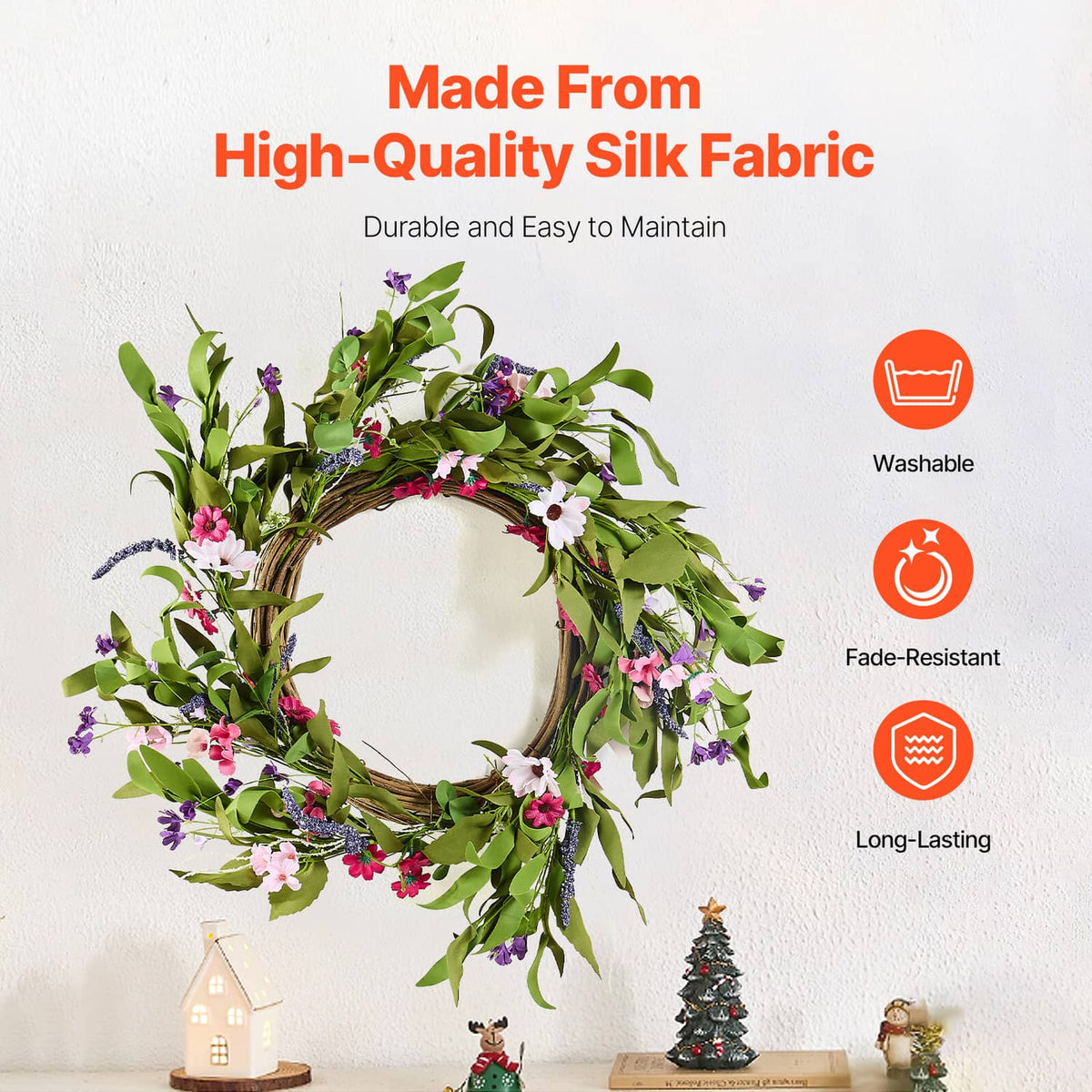 Artificial silk-fabric wreath with green leaves and pink, white, and purple blossoms