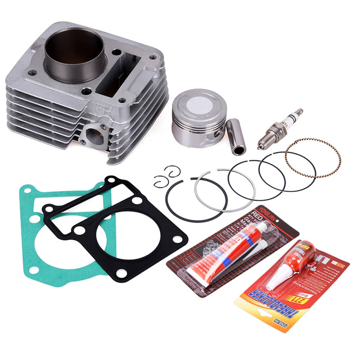 Cylinder kit components laid out: aluminum cylinder, piston, rings, gaskets, and sealants