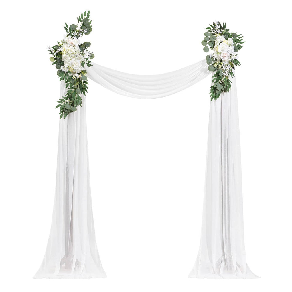 Wedding arch decor with white sheer drapes and faux greenery side flower clusters