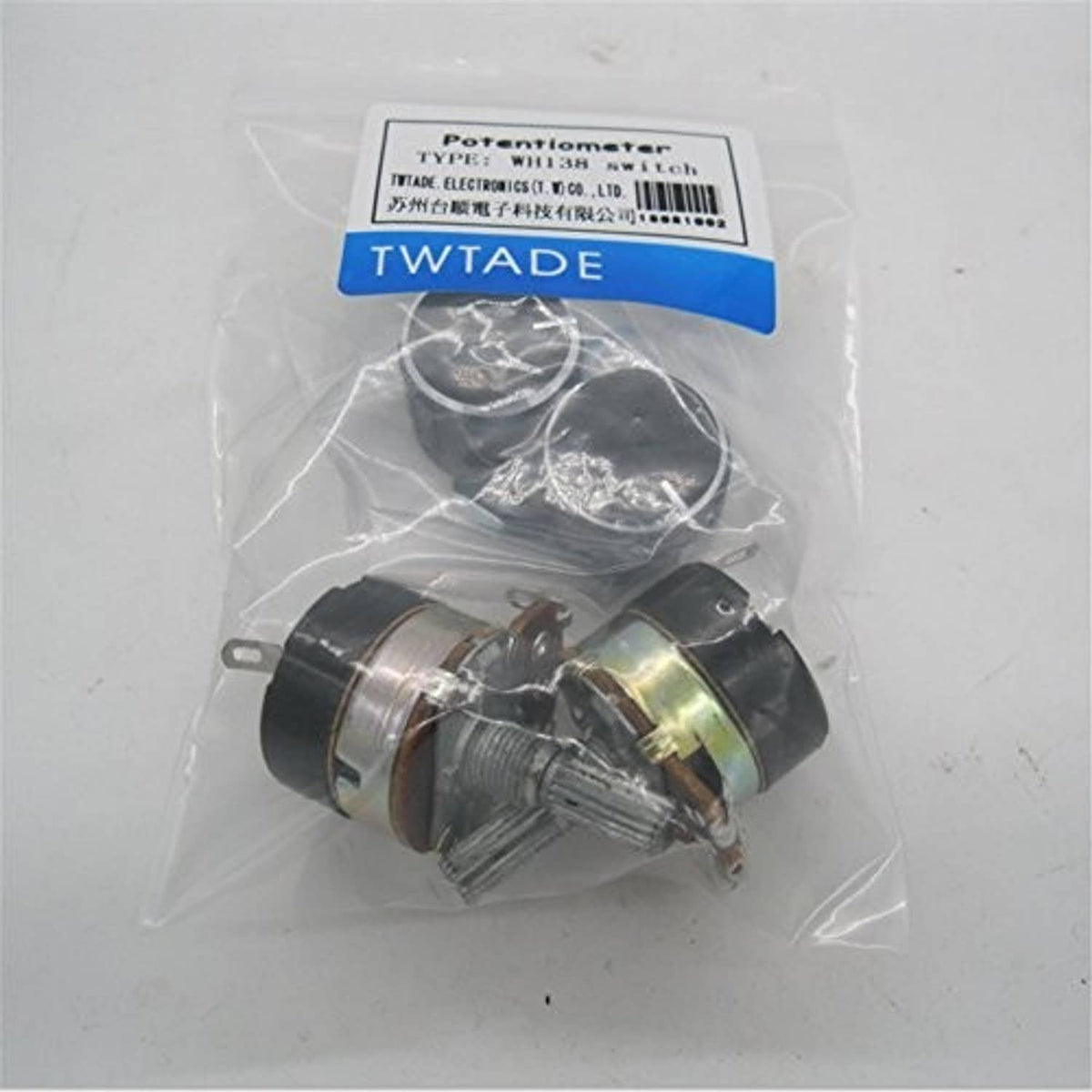 Bagged potentiometer set with black knobs and metal shafts inside clear plastic wrap