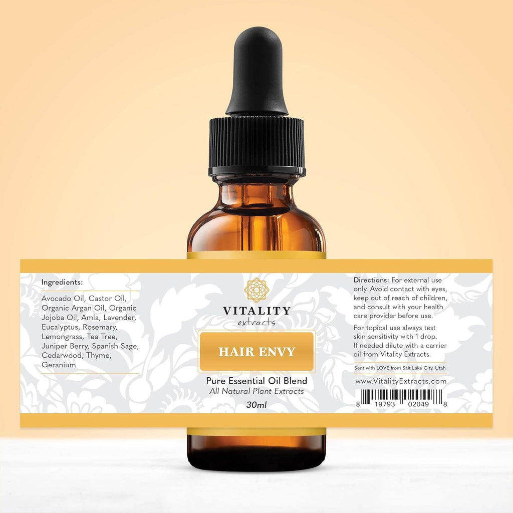 Amber hair serum bottle with label and amber dropper, back-side ingredients panel