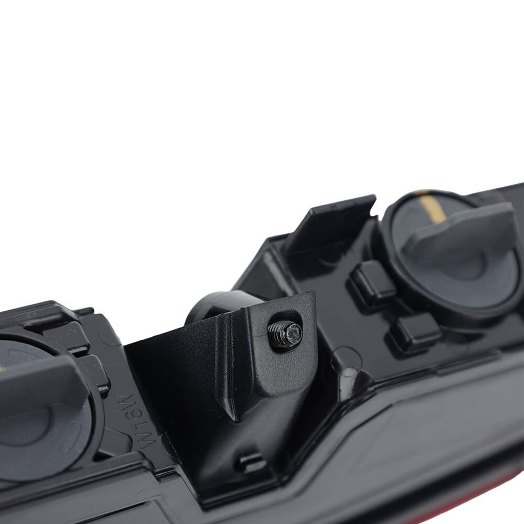 Tail light corner bracket detail with black plastic housing and mounting hardware