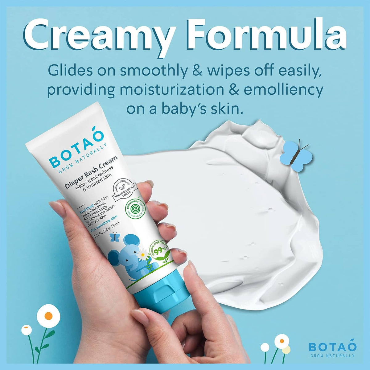 Diaper rash cream tube in a hand with a white cream smear shown beside it.