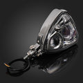 Motorcycle chrome triangle headlight assembly with mounted bracket and black wiring harness