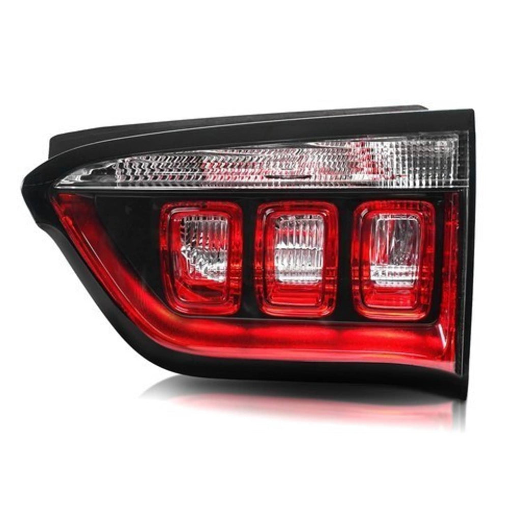 Right inner halogen tail light with three red lenses, bright clear reflector sections