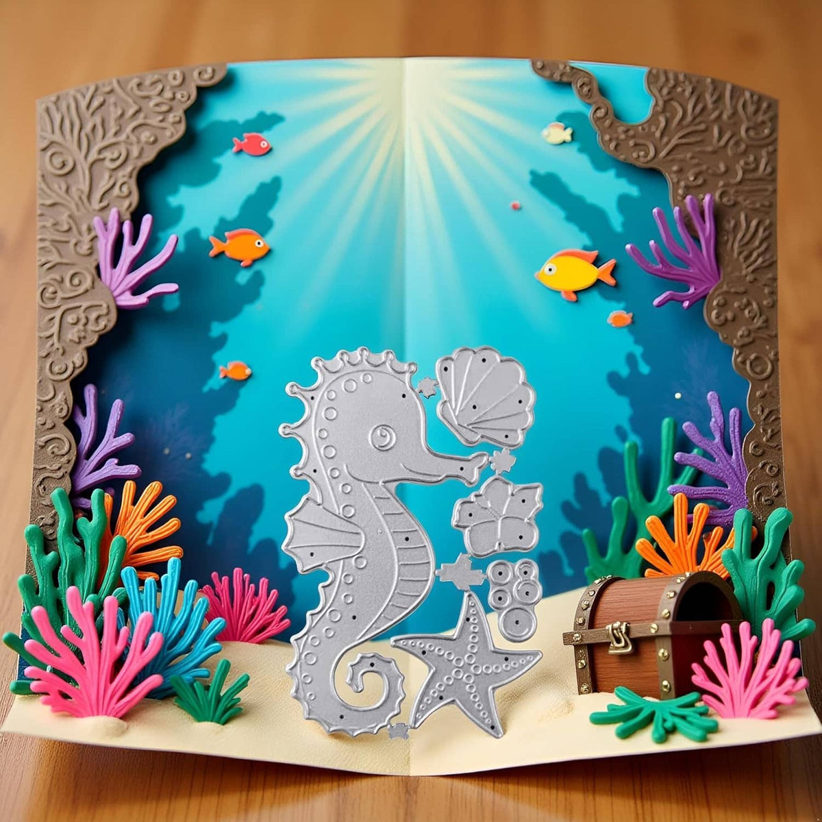 Silver seahorse die-cut centerpiece with shell, starfish, and small sea life shapes