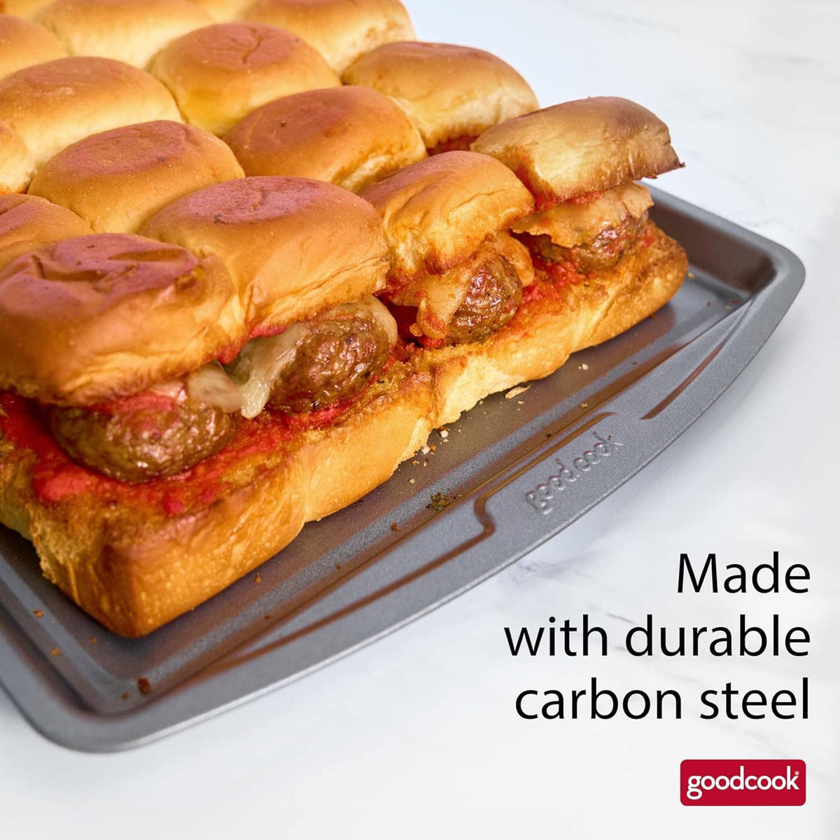 Gray nonstick baking sheet with topped pastries stacked on the tray