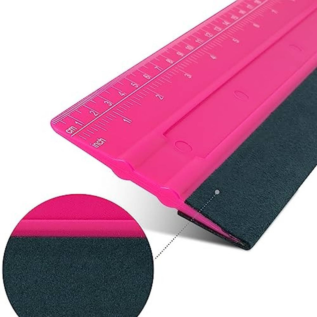 Close-up of rose pink vinyl squeegee tip with 25cm ruler scale and dark edge