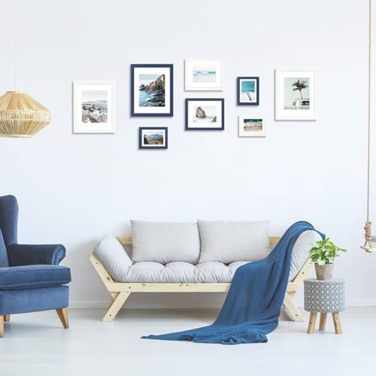 Set of white wall-mount picture frames with real glass displaying multiple photos