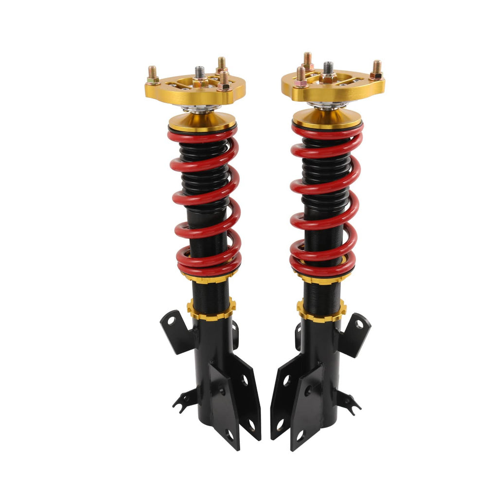Coilover strut pair with red springs, gold top plates, and black lower brackets