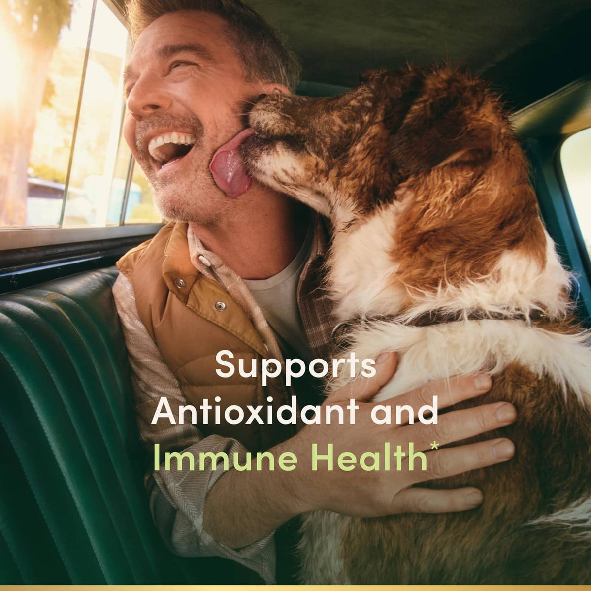 Man cuddling a brown dog with overlay text: Supports Antioxidant and Immune Health